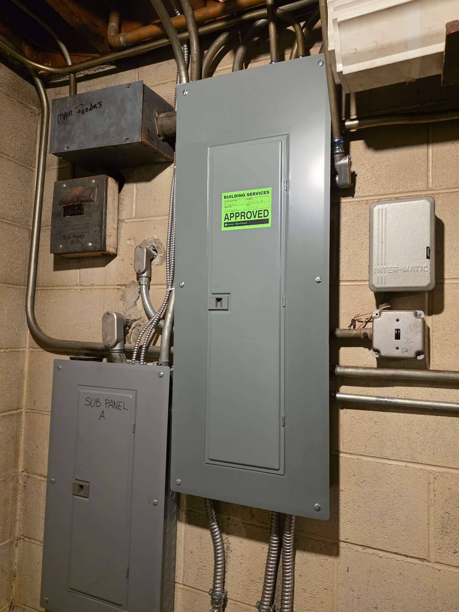 Approved Basement Service Upgrade — City building services approved main service panel and subpanel